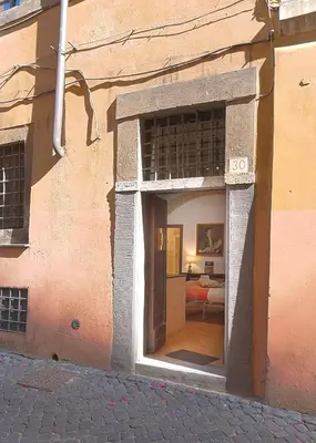 an entrance to a building with an open doorway at Casa De' Medici in via Giulia in Rome