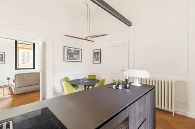 a large living room with a table and chairs at Charm and Elegance by The Spanish Steps in Rome