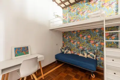 a small room with a desk and a mural at Campo de Fiori Large and Beautiful Apartment in Rome