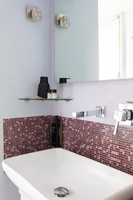 a bathroom with a white sink and a mirror at Campo de Fiori Large and Beautiful Apartment in Rome