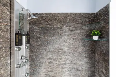 a brick wall in a bathroom with a shower at Campo de Fiori Large and Beautiful Apartment in Rome