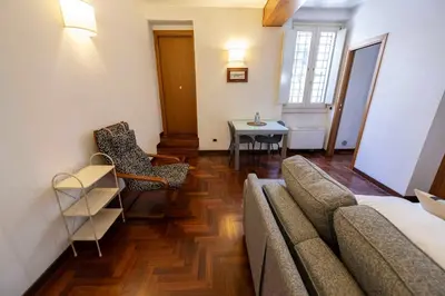 a living room with a couch and a table at FRAM Apartment Fori Imperiali in Rome