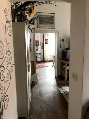 a hallway of a home with a room with a kitchen at Large apartment in Rome city center in Rome