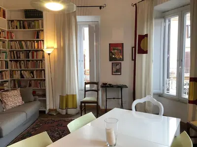 a living room with a couch and a table at Large apartment in Rome city center in Rome