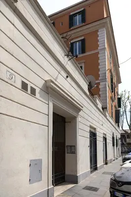 a large building with a garage on a street at CircusMaximus n.3 in Rome