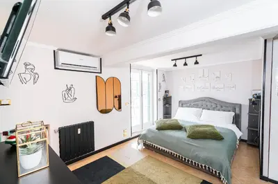 a white bedroom with a bed and a window at 4BNB - Loft del Papa in Rome