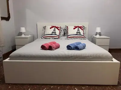 two pillows on a bed with two sails on it at M&M Pigneto Roma in Rome