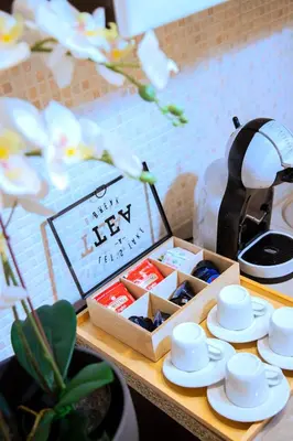 a box of tea cups and saucers on a table at Casa Donna Olimpia Appartamento Roma in Rome