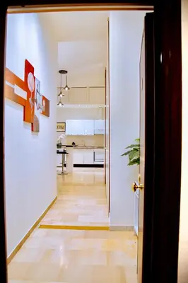 an open door to a room with a kitchen at Casa Donna Olimpia Appartamento Roma in Rome