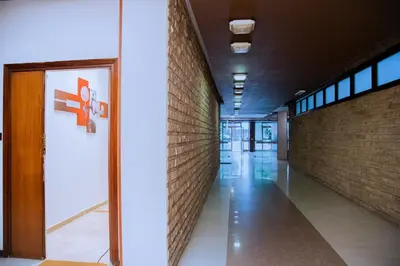 a hallway in a building with a brick wall at Casa Donna Olimpia Appartamento Roma in Rome