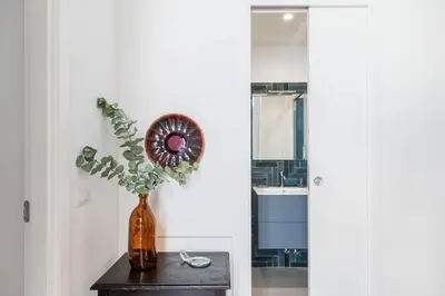 a vase with a plant in it on a table at iFlat Navona Cozy Apartament in Rome
