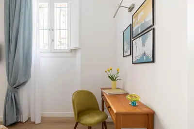 a room with a desk and a chair and a window at iFlat Navona Cozy Apartament in Rome