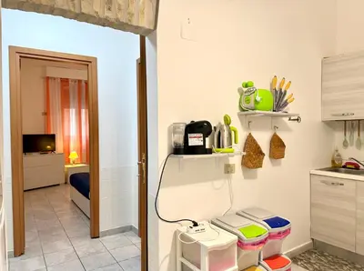 a room with a kitchen with a sink and a counter at Vaticano - 5 min da stazione in Rome