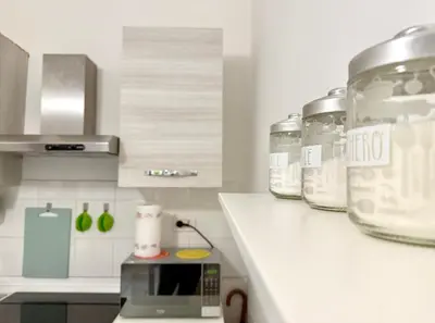 a kitchen with a counter with two jars on it at Vaticano - 5 min da stazione in Rome