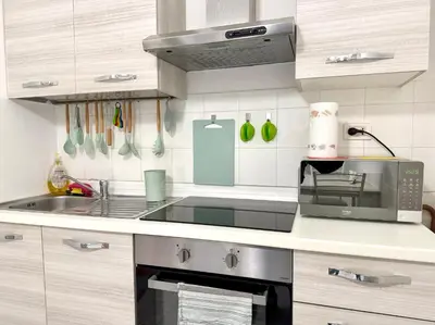 a kitchen with a sink and a microwave at Vaticano - 5 min da stazione in Rome