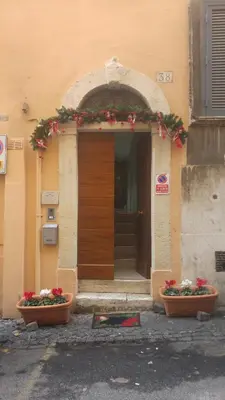 a building with two flower pots in front of a door at Excellence Suite in Rome