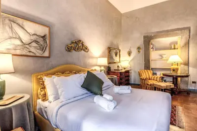 a living room with a couch and a table at Stylish 2 BDR Apt with Balcony by Pantheon & Forum in Rome