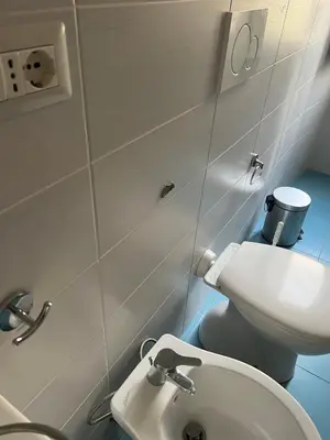a bathroom with a white toilet and a sink at Flaminia@213 in Rome