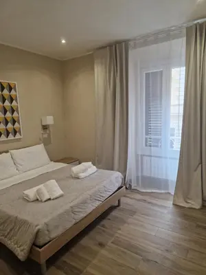 a bedroom with a bed with two towels on it at Cozy Luxury Room Turati in Rome