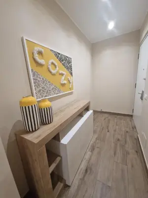 a room with a wooden bench and a painting on the wall at Cozy Luxury Room Turati in Rome