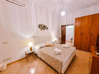 a bedroom with a bed with two towels on it at Vatican Shelter in Rome