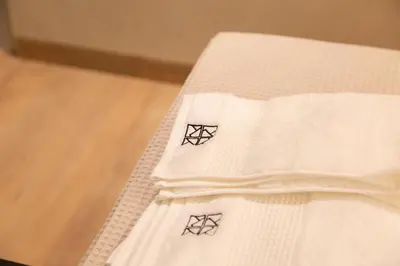 a close up of a white blanket with diamonds on it at Loft Bianca Mano in Rome