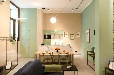 a living room with a table and a couch at Loft Bianca Mano in Rome