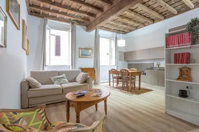 a living room with a couch and a table at Colosseum house in Rome
