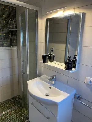 a bathroom with a white sink and a mirror at Trastevere onlyone in Rome