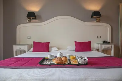 a tray of food sitting on top of a bed at Suite Castrense in Rome