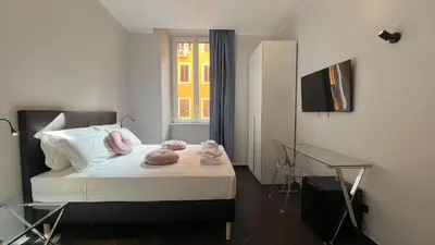 a bedroom with a bed with two stuffed animals on it at Cloud 9 Hotel in Rome