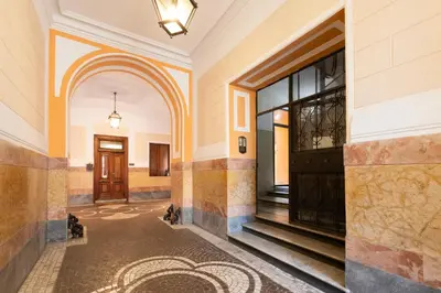 an empty hallway of a building with a door at Cloud 9 Hotel in Rome