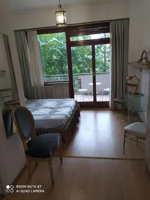 a bedroom with a bed and a sliding glass door at Vanity Apartment - 4 bedrooms with 4 bathrooms - AC & WIFI in Rome