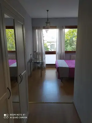 a room with a bedroom with a bed and a window at Vanity Apartment - 4 bedrooms with 4 bathrooms - AC & WIFI in Rome
