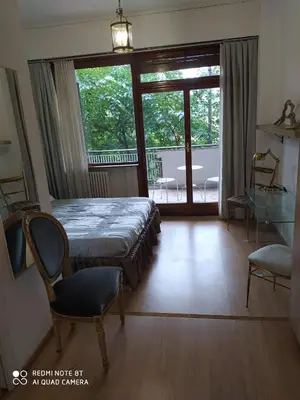 a bedroom with a bed and a sliding glass door at Vanity Apartment - 4 bedrooms with 4 bathrooms - AC & WIFI in Rome