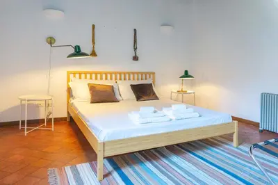 a bedroom with a bed with towels on it at EasyTopStay - Cosy Flat near Castel S Angelo in Rome