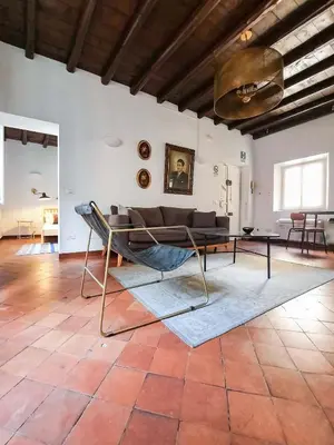 a living room with a couch and a table at EasyTopStay - Cosy Flat near Castel S Angelo in Rome