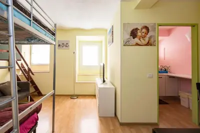 a dorm room with bunk beds and a hallway at Holiday House Esedra in Rome