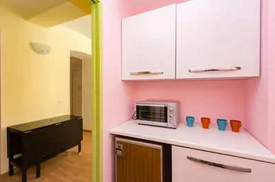 a kitchen with a counter top with a microwave at Holiday House Esedra in Rome