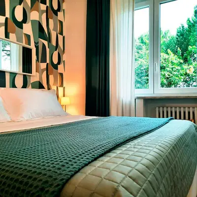 a bedroom with a bed and a window at La casa di Livia in Rome