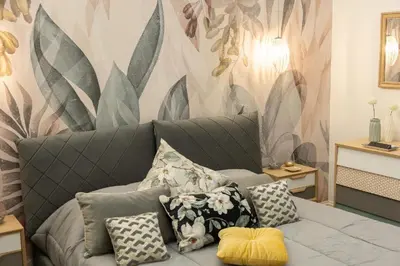 a living room with a gray couch with pillows at SolferinoNove in Rome