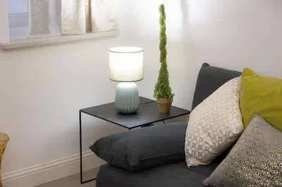 a living room with a couch and a table with a lamp at SolferinoNove in Rome