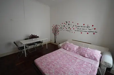 a living room with a couch and a table at Holiday House Naiadis in Rome