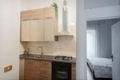 a kitchen with a sink and a stove top oven at Obiettivo Roma in Rome