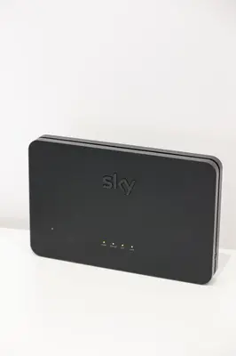 a black device sitting on a white table at Trastevere Magic House Luxury Suite in Rome