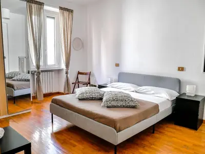 a bedroom with a bed with two pillows on it at Modern 1 Bedroom near metro in Rome
