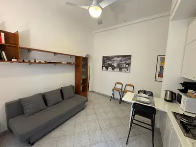 a living room with a couch and a table at Cozy apartment in Rome Trastevere in Rome