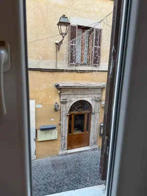 a view of a building with a door and a balcony at Cozy apartment in Rome Trastevere in Rome
