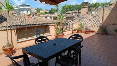 a blue table and chairs on a patio at Cozy apartment in Rome Trastevere in Rome