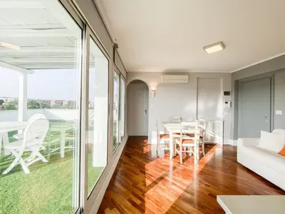 a living room with a table and a couch at Al 13 - La Terrazza in Rome